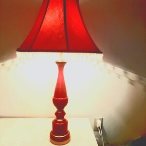 Retro Tangerine Red and Gold Chalkware Table lamp with fringed shade.